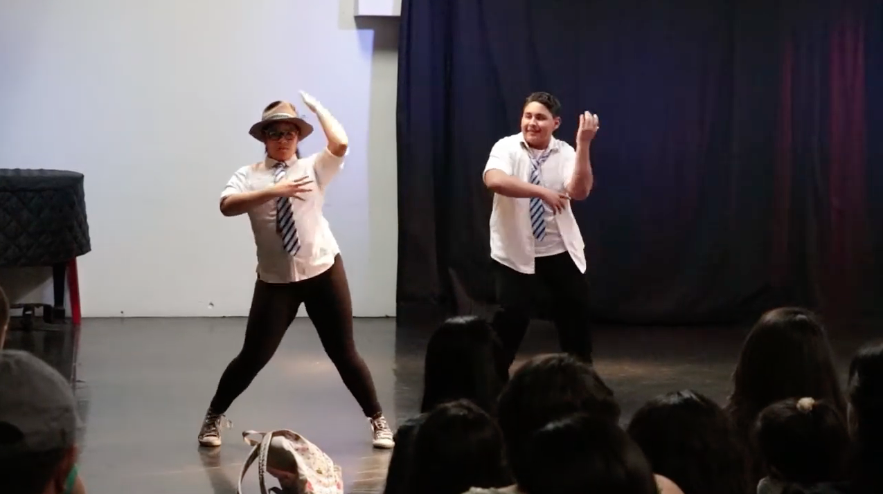 Girl and Boy Dancing on Stage